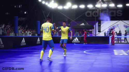 A Soccer Player Wearing A Yellow Jersey With The Number 40 On It Celebrates With Another Player GIF