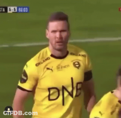 A Soccer Player Wearing A Yellow Jersey With The Word Dnb Written On His Chest GIF
