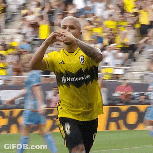 A Soccer Player Wearing A Yellow Shirt That Says Nationwide GIF