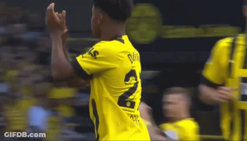 A Soccer Player Wearing A Yellow Shirt With The Number 2 On It GIF
