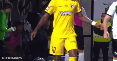 A Soccer Player Wearing A Yellow Uniform With The Number 10 On It GIF