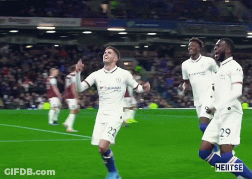 A Soccer Player Wearing A Yokohama Jersey Is Celebrating With His Teammates GIF