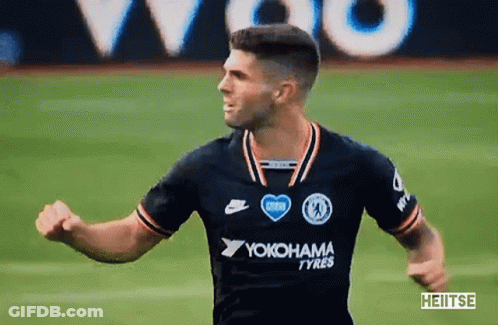 A Soccer Player Wearing A Yokohama Tyres Jersey Is Running On The Field GIF