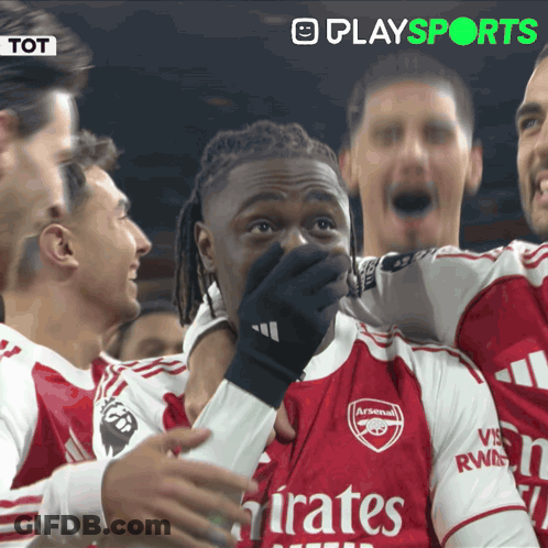 A Soccer Player Wearing An Arsenal Jersey Covers His Mouth With His Hand GIF