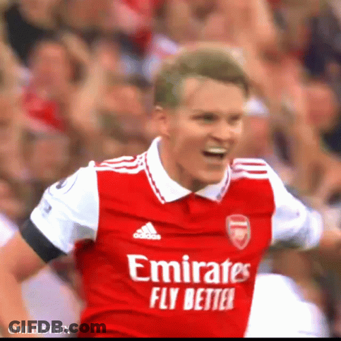 A Soccer Player Wearing An Emirates Fly Better Jersey Celebrates GIF