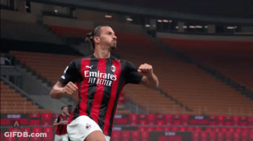 A Soccer Player Wearing An Emirates Fly Better Jersey Celebrates A Goal GIF