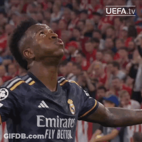 A Soccer Player Wearing An Emirates Fly Better Jersey Looks Up At The Sky GIF