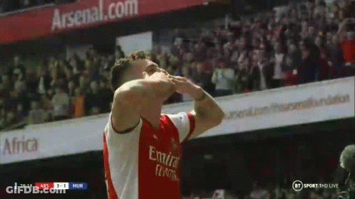 A Soccer Player Wearing An Emirates Fly Emirates Jersey Celebrates GIF