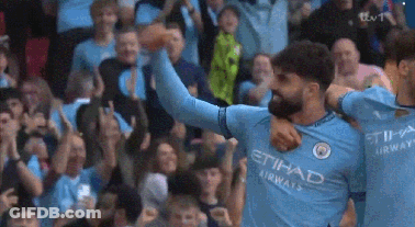 A Soccer Player Wearing An Etihad Airways Jersey Is Celebrating A Goal GIF