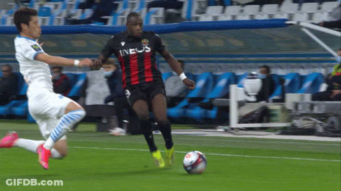 A Soccer Player Wearing An Ineos Jersey Dribbles A Ball GIF