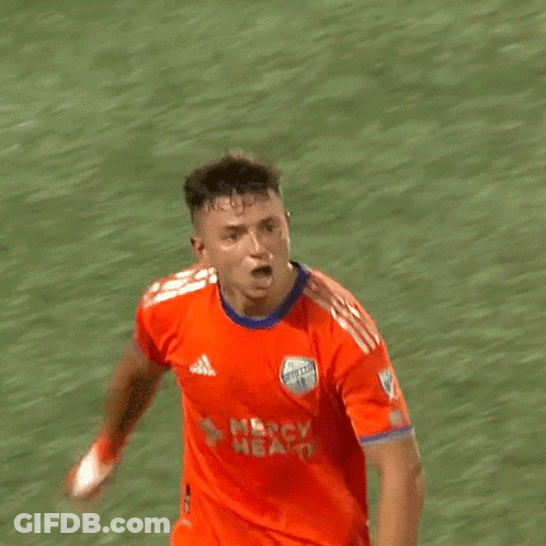 A Soccer Player Wearing An Orange Jersey That Says Nbc Health On It GIF
