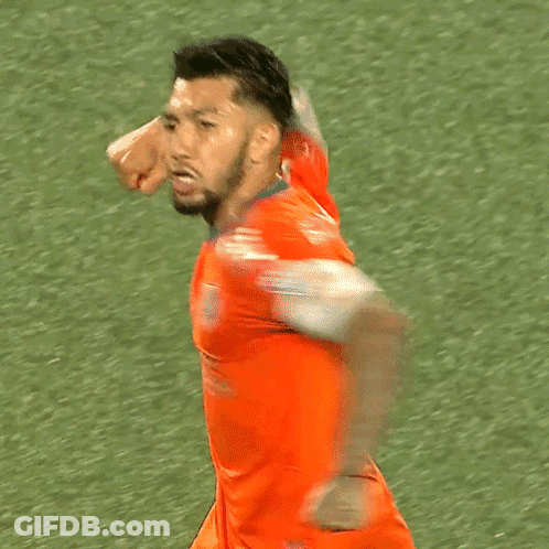 A Soccer Player Wearing An Orange Jersey With The Word Capital On The Sleeve GIF