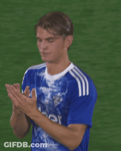 A Soccer Player Wearing An Uber Jersey Covering His Face With His Hands GIF