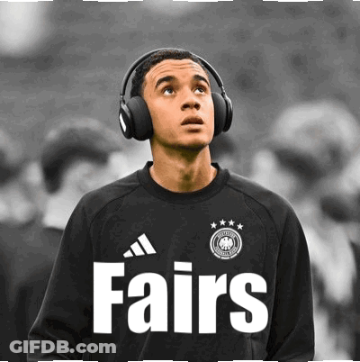 A Soccer Player Wearing Headphones And A Fairs Jersey GIF