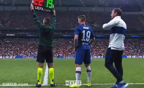 A Soccer Player Wearing Number 19 Stands On The Field GIF