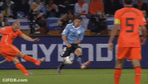 A Soccer Player Wearing Number 5 Kicks The Ball GIF