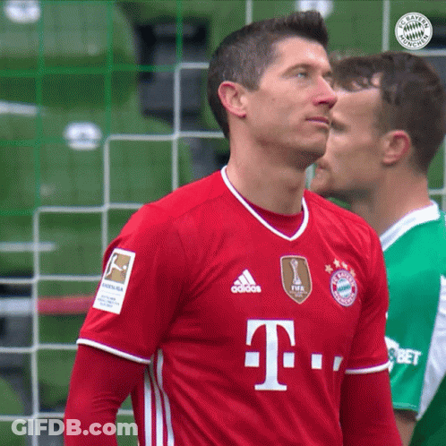 A Soccer Player Wears A Red Adidas Shirt With The Letter T On It GIF
