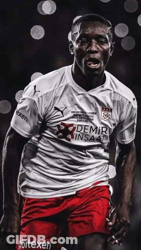 A Soccer Player Wears A White Shirt With Demir Insaat On It GIF