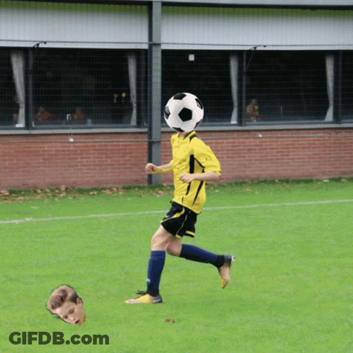 A Soccer Player With A Soccer Ball On His Head In Front Of A Brick Wall GIF