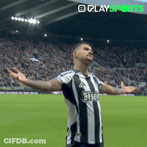 A Soccer Player With His Arms Outstretched Is Wearing A Black And White Striped Shirt That Says Iseki GIF