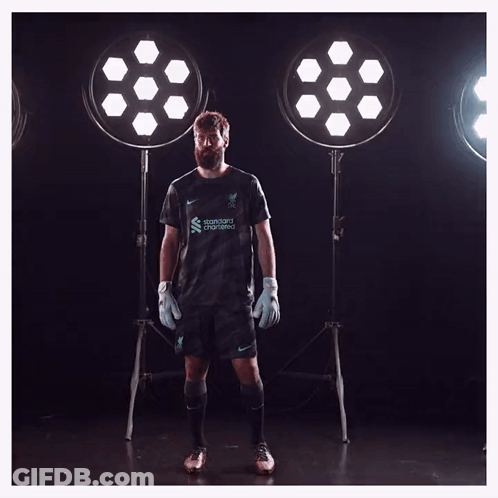 A Soccer Player With The Name Allison In White GIF