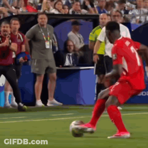 A Soccer Player With The Number 1 On His Jersey Is Kicking A Ball GIF