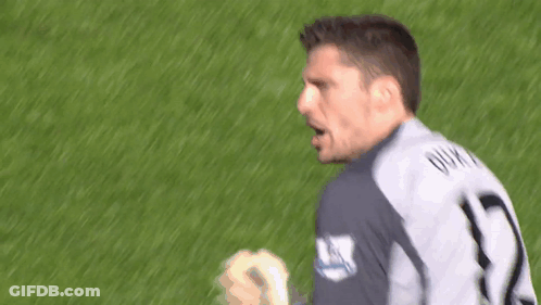 A Soccer Player With The Number 1 On His Jersey Stands On The Field GIF