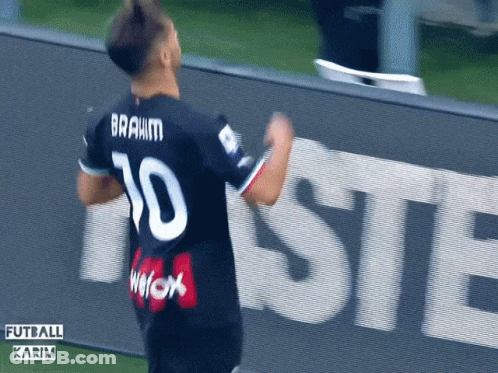A Soccer Player With The Number 10 On His Jersey Is Celebrating GIF