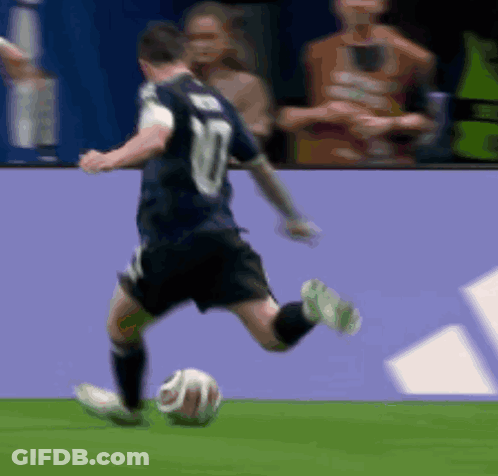 A Soccer Player With The Number 10 On His Jersey Is Kicking A Soccer Ball GIF