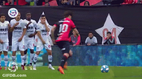 A Soccer Player With The Number 10 On His Jersey Is Kicking The Ball GIF