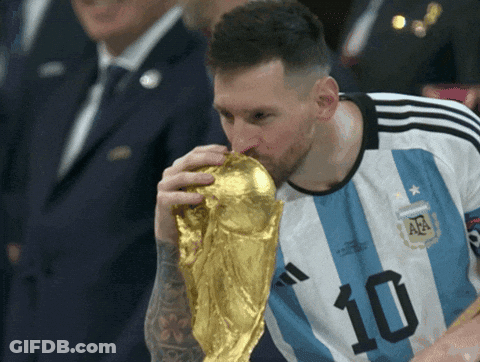 A Soccer Player With The Number 10 On His Jersey Is Kissing A Trophy GIF