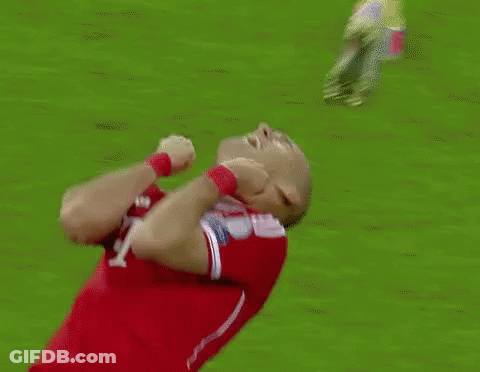 A Soccer Player With The Number 10 On His Jersey Is Kneeling Down On The Field GIF