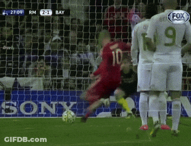 A Soccer Player With The Number 10 On His Jersey Kicks The Ball GIF