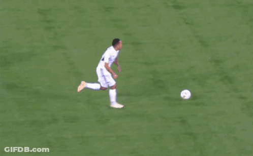 A Soccer Player With The Number 10 On His Jersey Kicks The Ball GIF