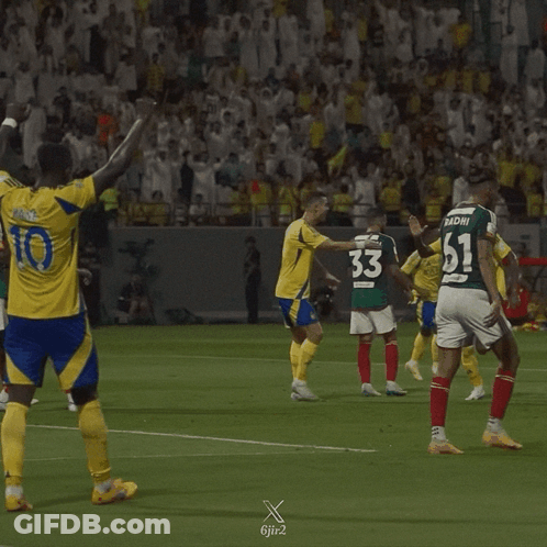 A Soccer Player With The Number 10 On His Jersey Stands On The Field GIF