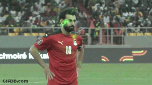 A Soccer Player With The Number 10 On His Jersey Stands On The Field GIF