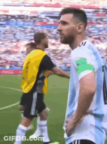 A Soccer Player With The Number 10 On His Jersey Stands On The Field GIF