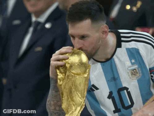 A Soccer Player With The Number 10 On His Shirt Is Kissing A Trophy GIF