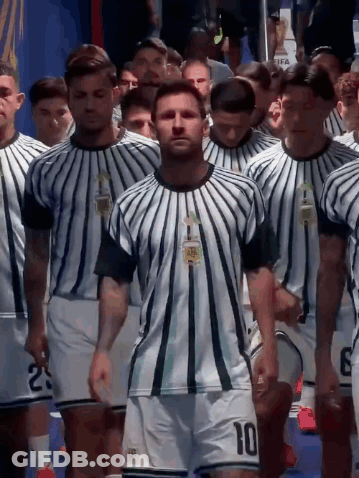 A Soccer Player With The Number 10 On His Shorts Walks With His Team GIF