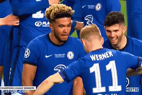 A Soccer Player With The Number 11 On His Back Is Hugging Another Player GIF