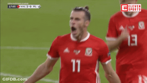 A Soccer Player With The Number 11 On His Jersey Is Celebrating GIF