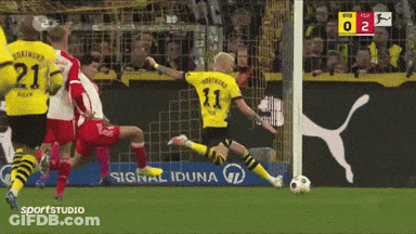 A Soccer Player With The Number 11 On His Jersey Is Kicking The Ball GIF
