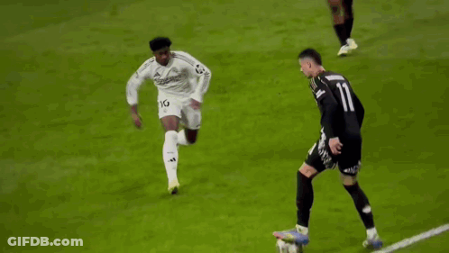 A Soccer Player With The Number 11 On His Jersey Is Running On The Field . GIF