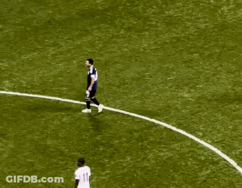 A Soccer Player With The Number 11 On His Jersey Is Surrounded By Other Players GIF