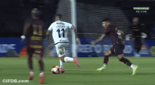 A Soccer Player With The Number 11 On His Jersey Kicks The Ball GIF