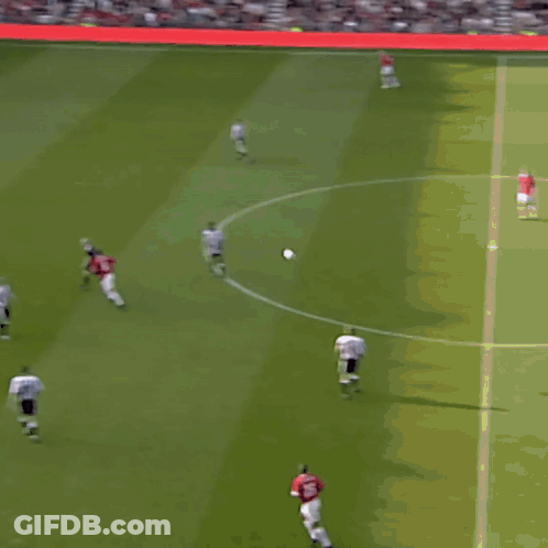 A Soccer Player With The Number 11 On His Jersey Stands On The Field GIF