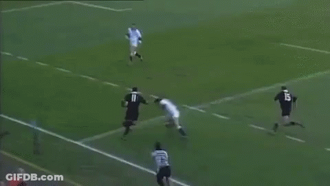 A Soccer Player With The Number 11 On His Shirt Is Laying On The Ground . GIF