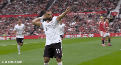 A Soccer Player With The Number 11 On His Shorts Celebrates GIF