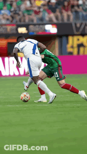 A Soccer Player With The Number 11 On His Shorts Is Trying To Steal The Ball From Another Player GIF