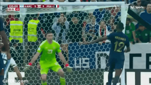 A Soccer Player With The Number 12 On His Jersey Is Getting Ready To Kick The Ball GIF